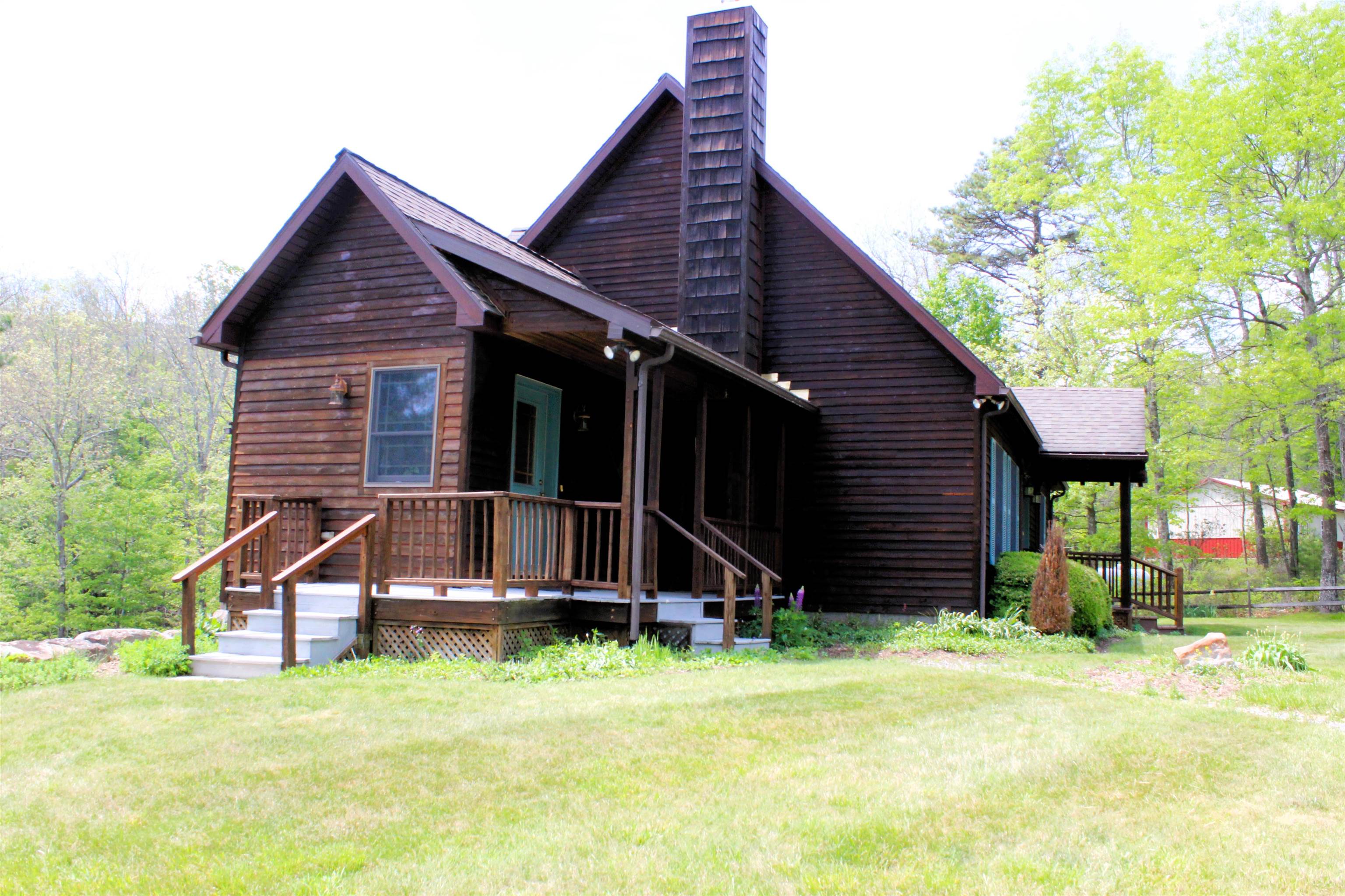 625 Hummingbird Lane Monterey, VA 24465 - Photo 3 of 65 a backyard of a house with wooden fence and a large tree