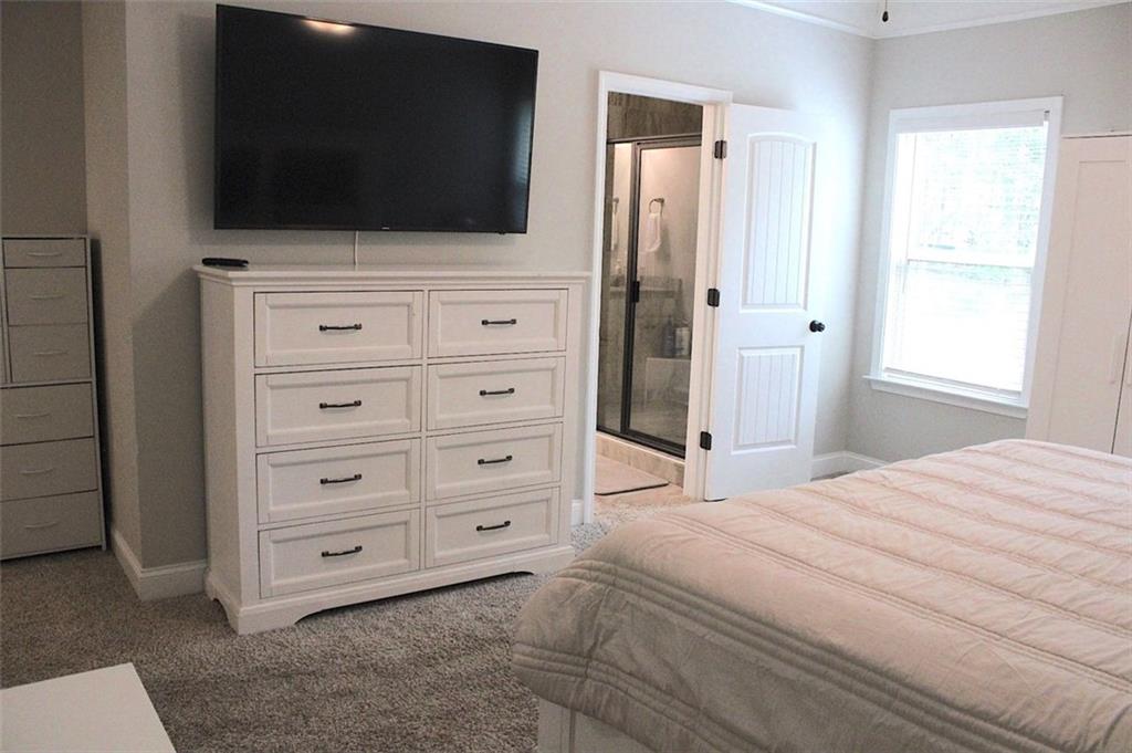 728 Harmony Road Temple, GA 30179 - Photo 16 of 29 a bed room with a television and a bed