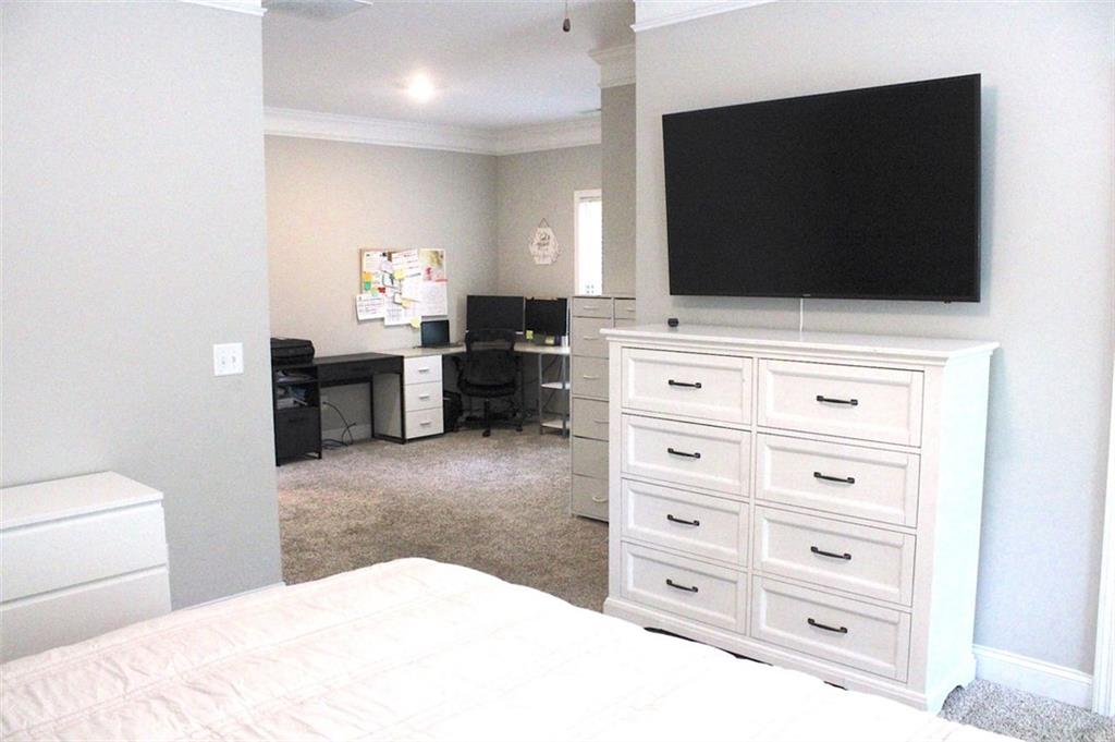 728 Harmony Road Temple, GA 30179 - Photo 19 of 29 a bathroom with a sink and a flat screen tv