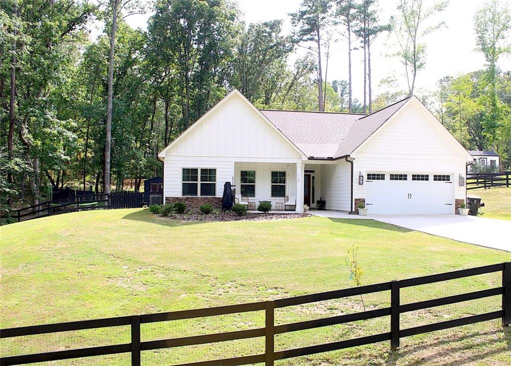 728 Harmony Road Temple, GA 30179 - Photo 2 of 29 a view of a house with pool and sitting area