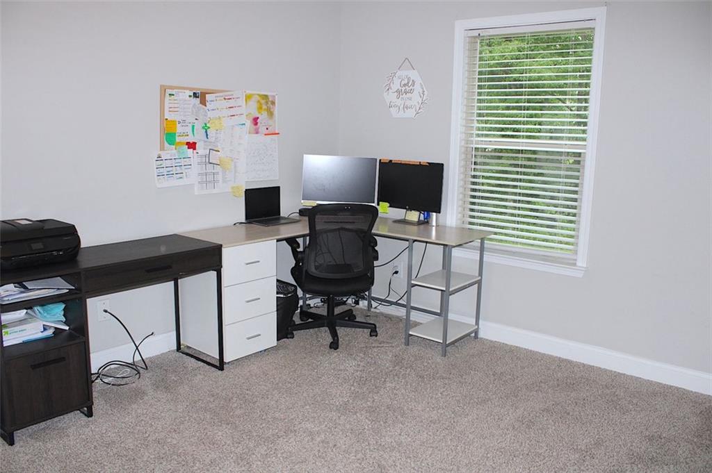 728 Harmony Road Temple, GA 30179 - Photo 23 of 29 a view of a workspace with furniture and a window