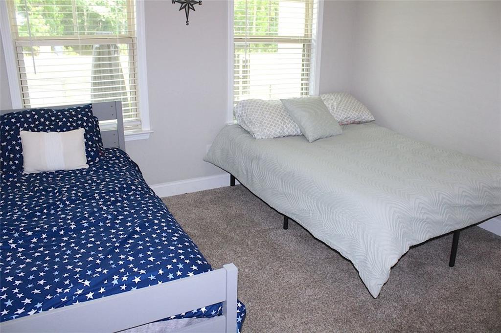 728 Harmony Road Temple, GA 30179 - Photo 24 of 29 a bedroom with a bed and a large window