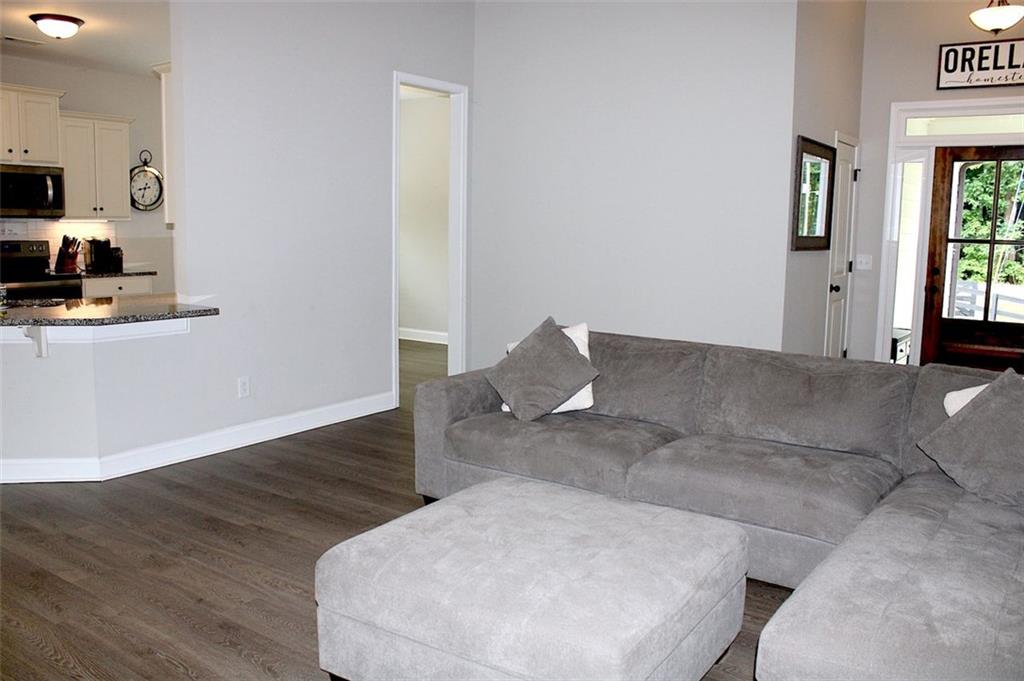 728 Harmony Road Temple, GA 30179 - Photo 8 of 29 a living room with furniture and a flat screen tv