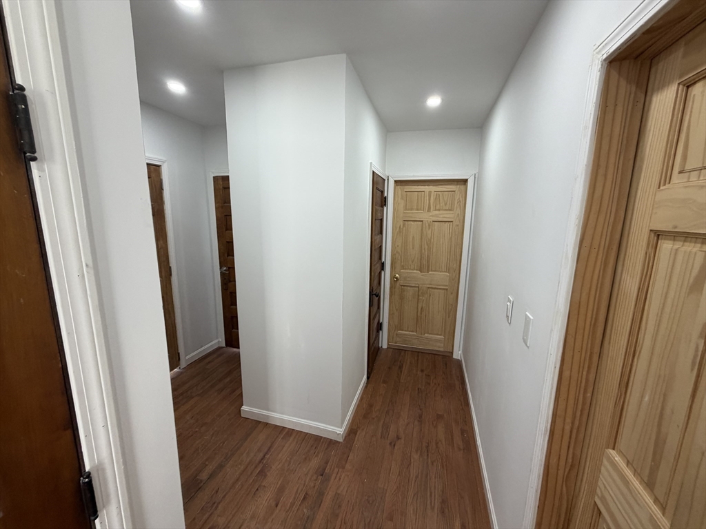 12 Stoneland Road Worcester, MA 01603 - Photo 18 of 36 a view of hallway with wooden floor
