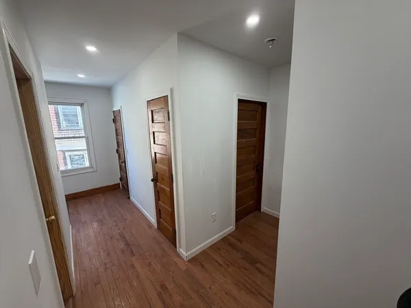 a bed room with a bed and a window