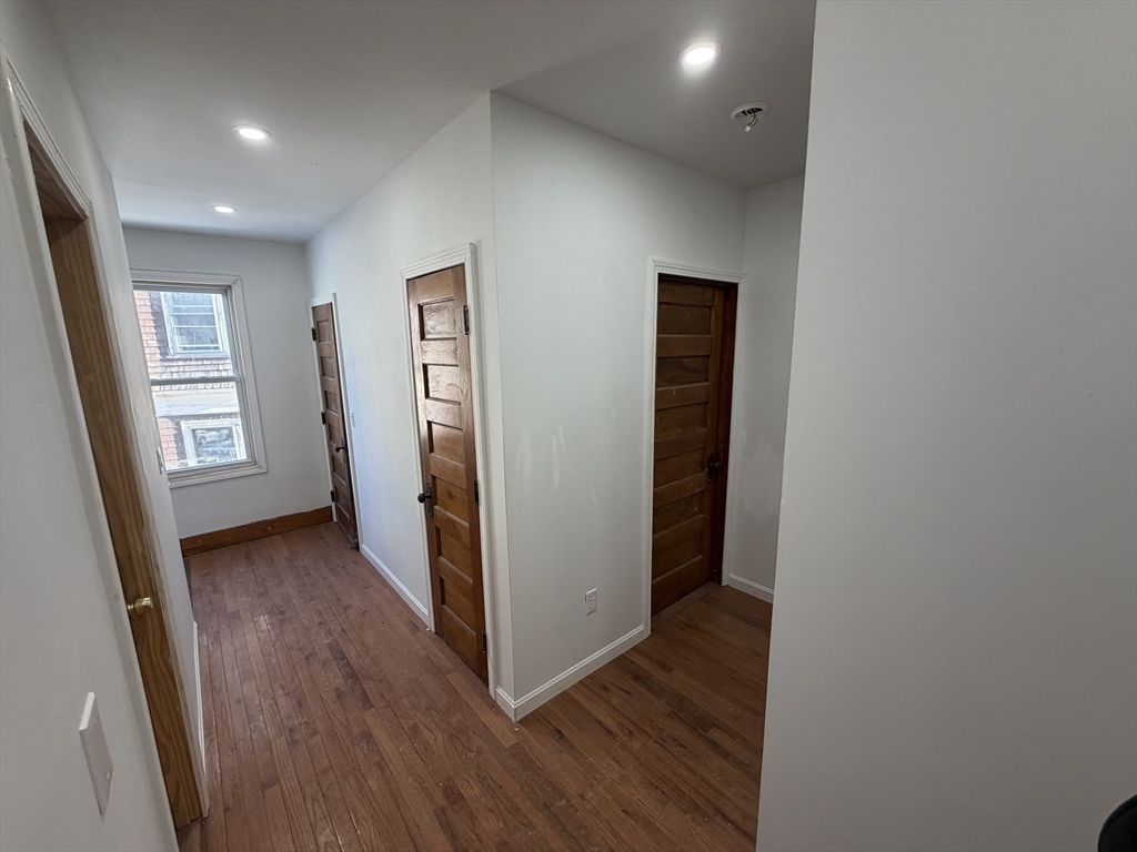12 Stoneland Road Worcester, MA 01603 - Photo 19 of 36 wooden floor in an empty room with a window