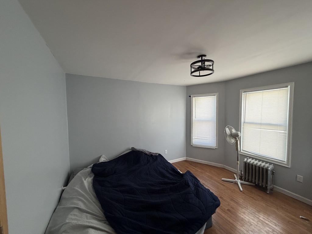 12 Stoneland Road Worcester, MA 01603 - Photo 20 of 36 a bed room with a bed and a window