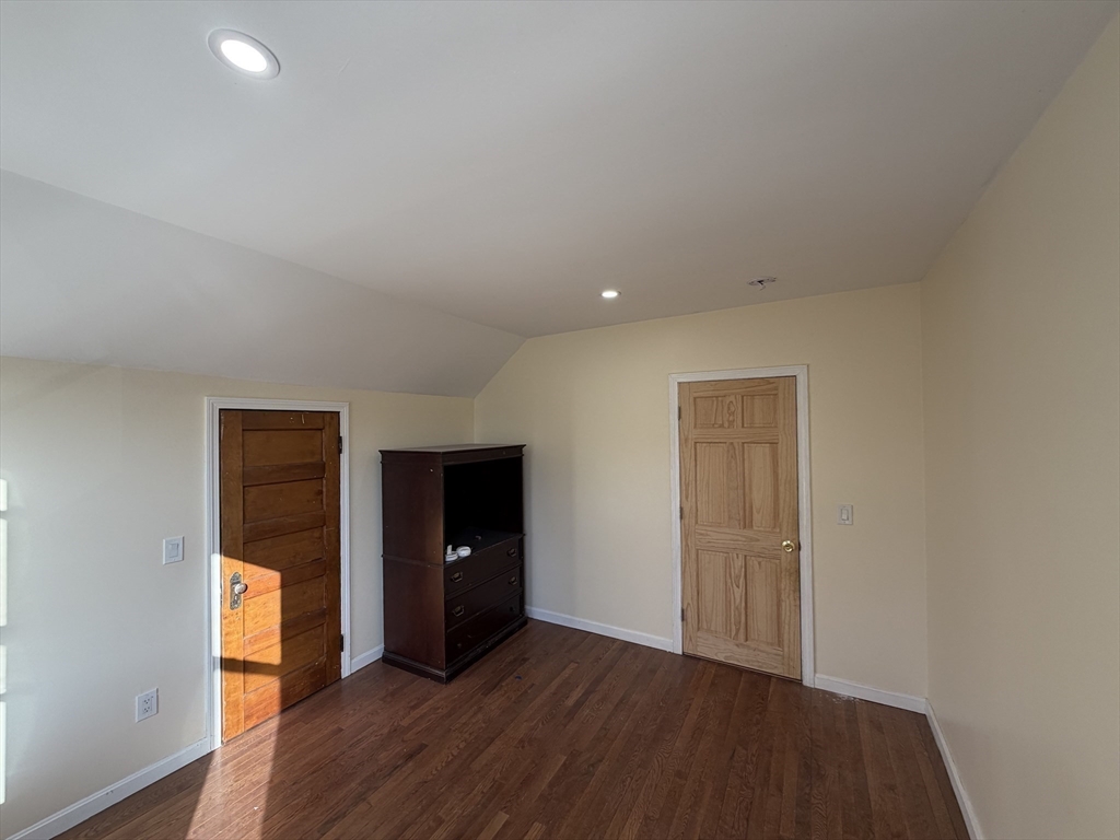 12 Stoneland Road Worcester, MA 01603 - Photo 21 of 36 an empty room with wooden floor and closet