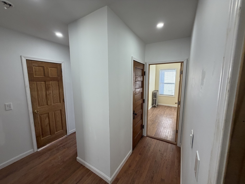 12 Stoneland Road Worcester, MA 01603 - Photo 23 of 36 an entryway and a hallway with wooden floor