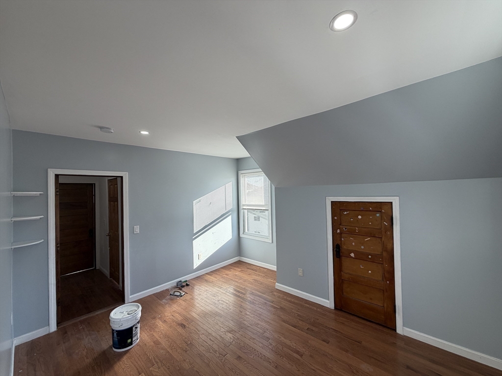 12 Stoneland Road Worcester, MA 01603 - Photo 24 of 36 wooden floor in an empty room with a window