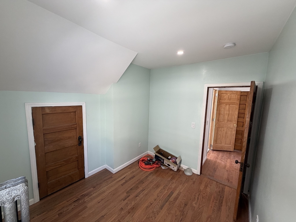 12 Stoneland Road Worcester, MA 01603 - Photo 28 of 36 a bedroom with a bed and a mirror