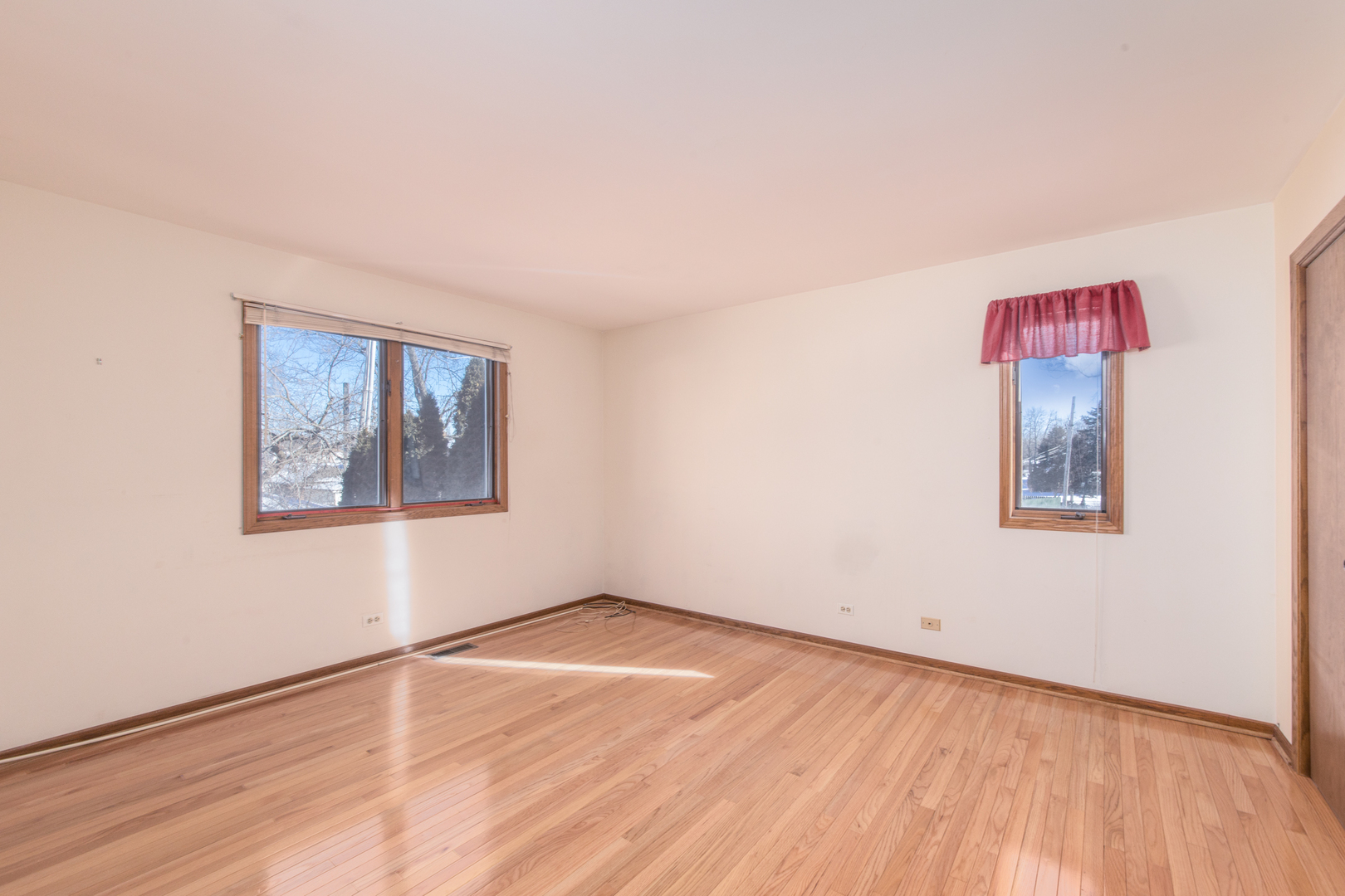 1414 West Talcott Road Park Ridge, IL 60068 - Photo 28 of 41 an empty room with wooden floor and windows