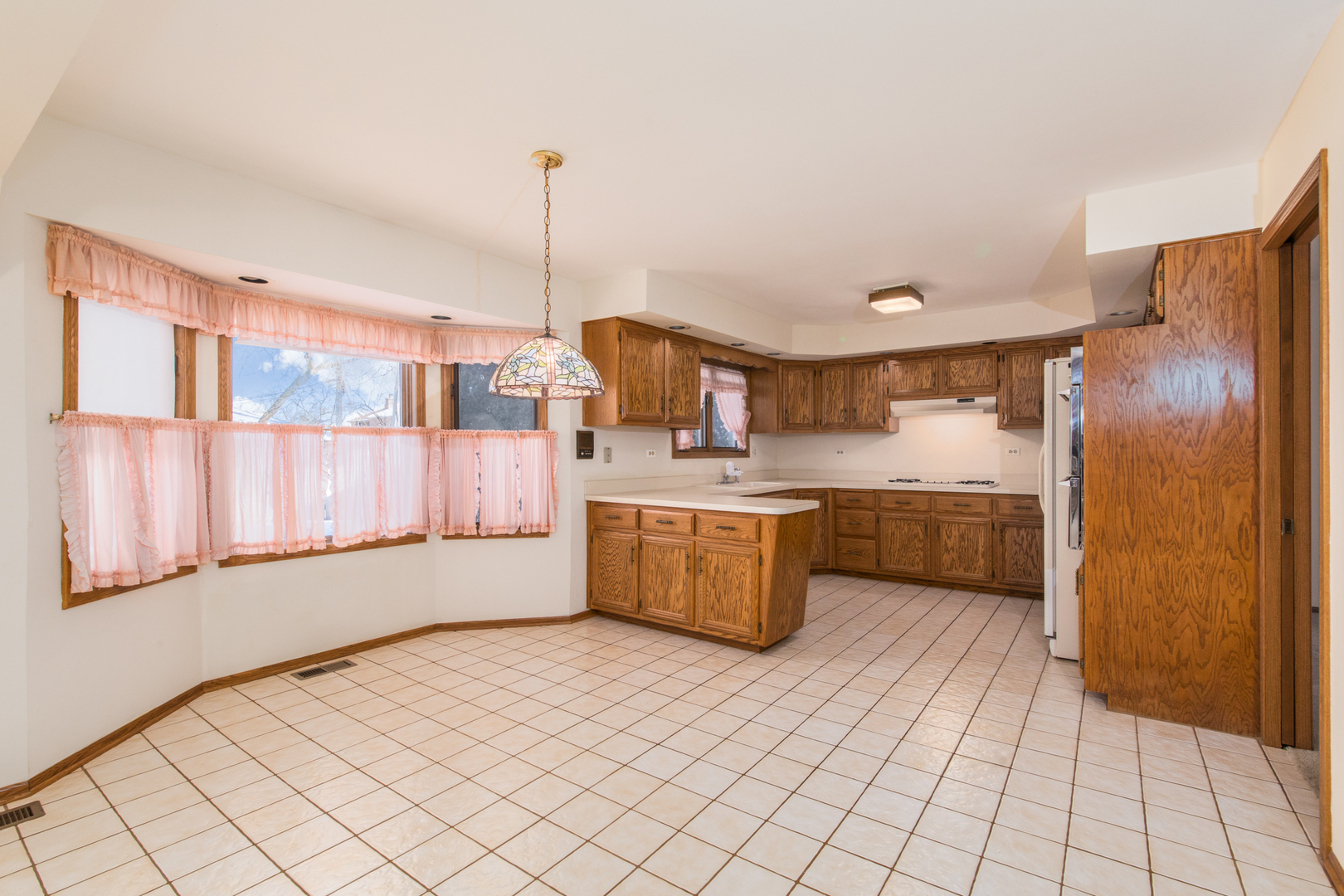 1414 West Talcott Road Park Ridge, IL 60068 - Photo 4 of 41 a kitchen with stainless steel appliances a refrigerator sink and cabinets