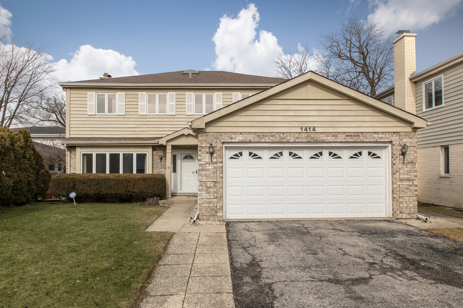 1414 West Talcott Road Park Ridge, IL 60068 - Photo 41 of 41 a front view of a house with a garden and plants