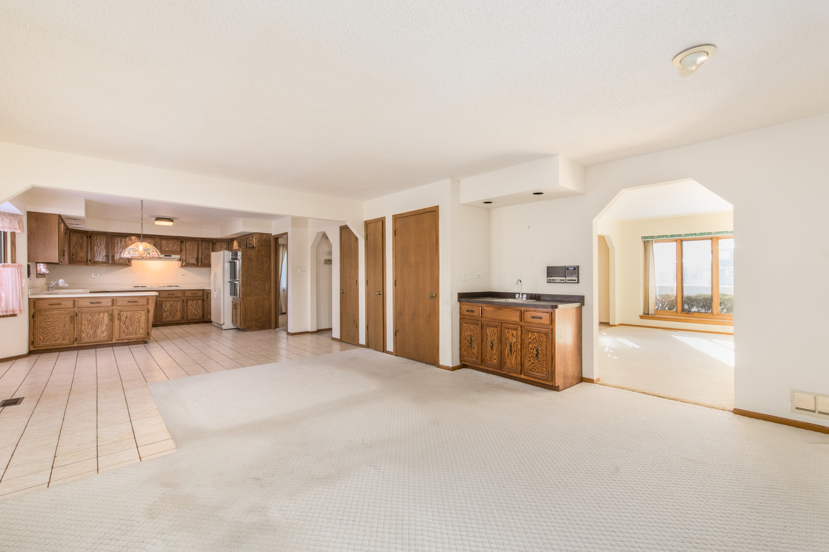 1414 West Talcott Road Park Ridge, IL 60068 - Photo 9 of 41 a large bedroom with a large bed and a chandelier