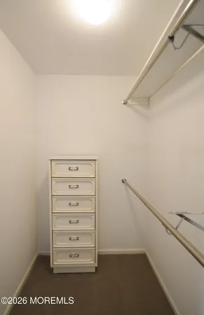 a bed room with a bed and a lamp