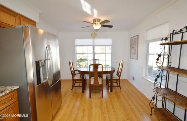 a kitchen with stainless steel appliances granite countertop a refrigerator stove top oven and sink