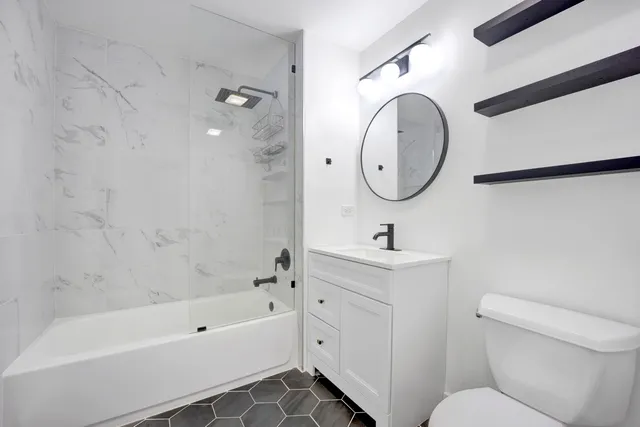 a bathroom with a toilet sink and a bathtub