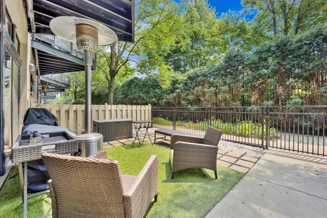 a view of a patio with a table chairs and a couch