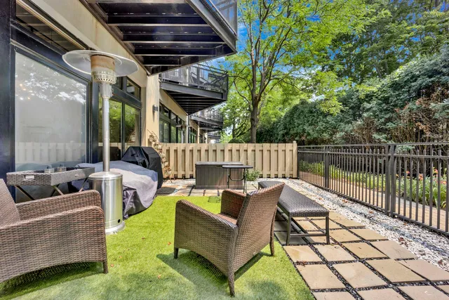 a outdoor living space with patio furniture and a potted plant