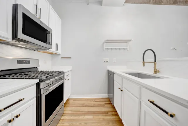 a kitchen with a stove and a sink