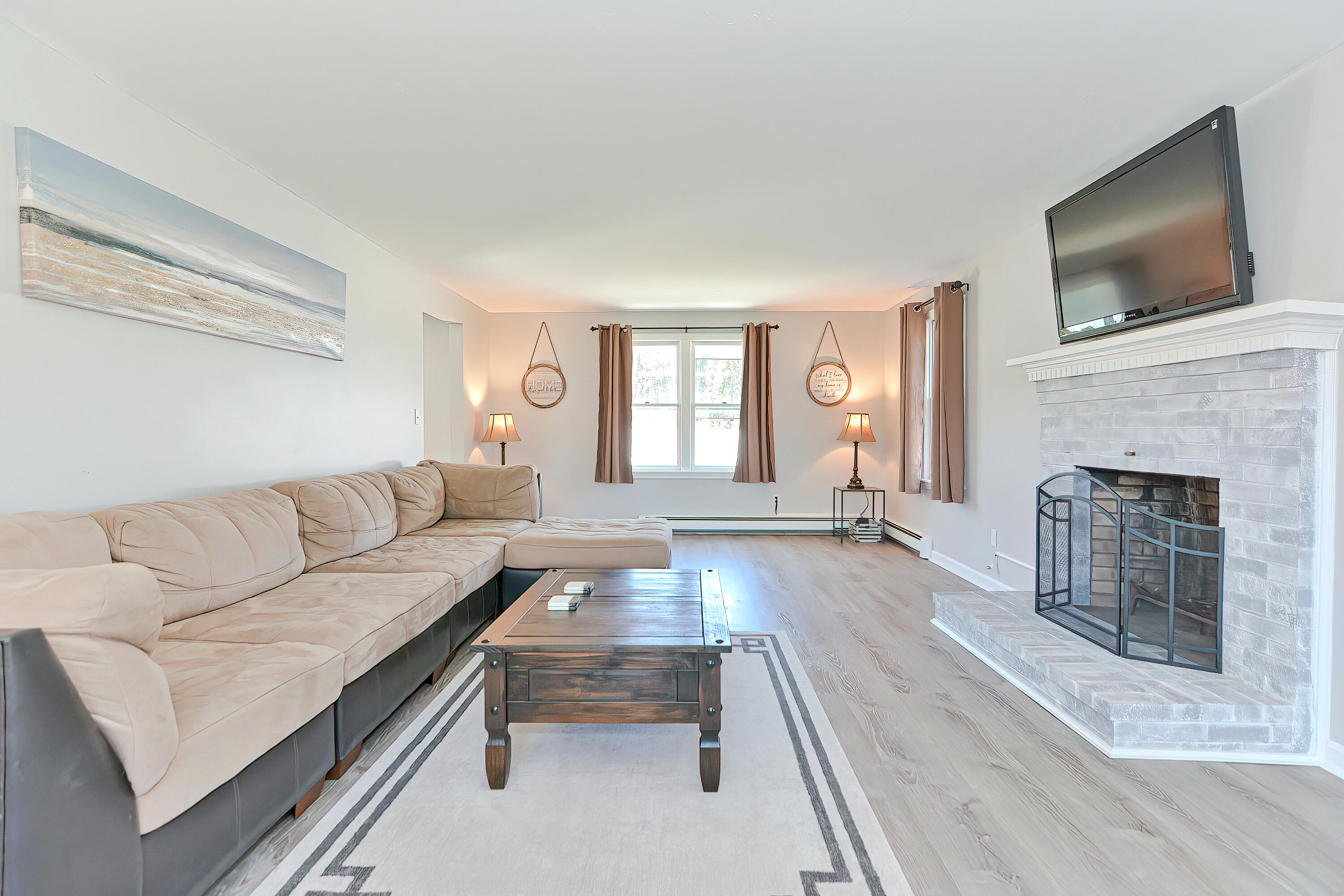 7 Wellfield Road Forestdale, MA 02644 - Photo 11 of 42 a living room with furniture and a fireplace