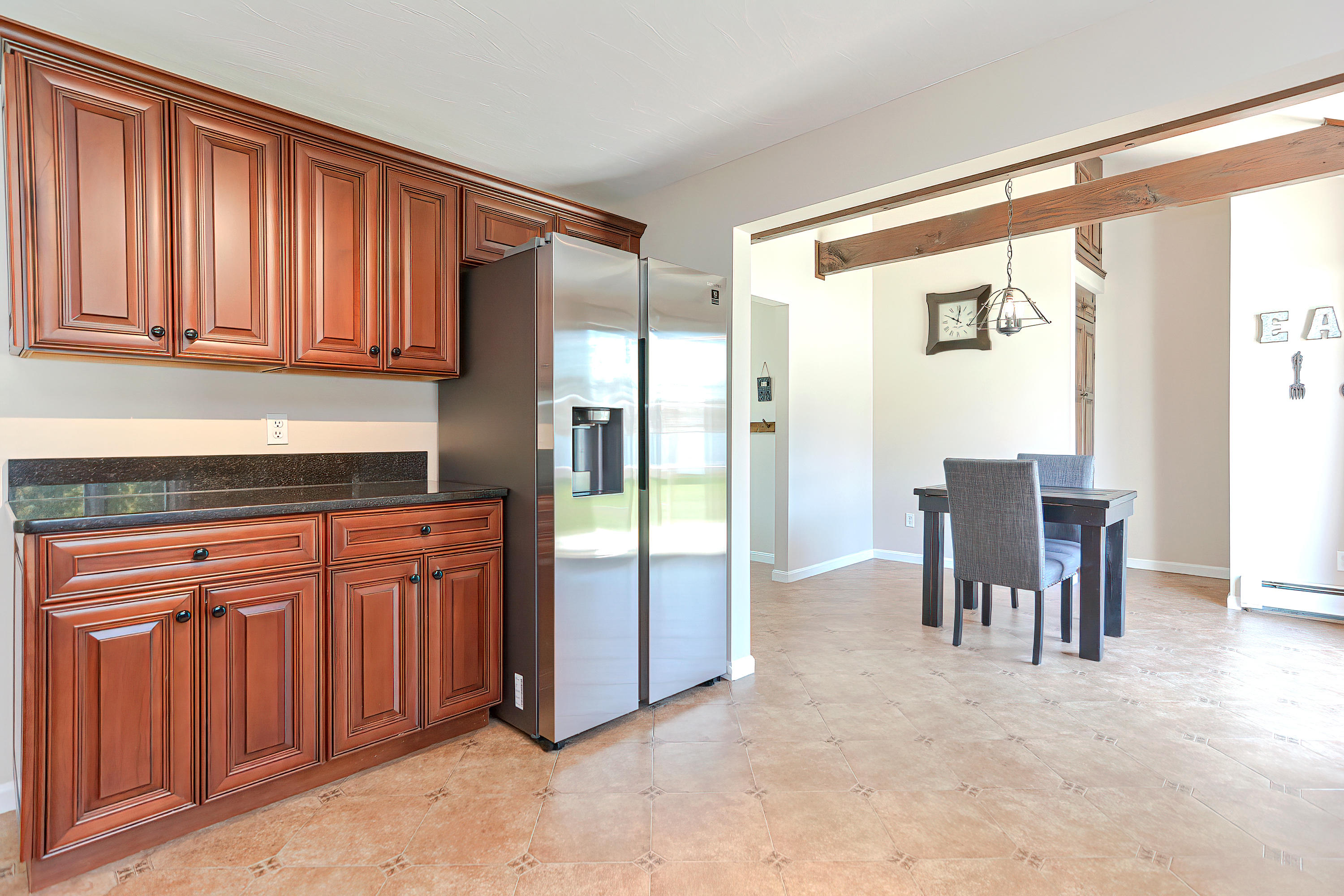 7 Wellfield Road Forestdale, MA 02644 - Photo 17 of 42 a kitchen with stainless steel appliances granite countertop a refrigerator and dining table