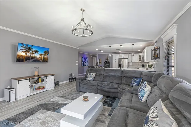 a living room with furniture a rug and a window