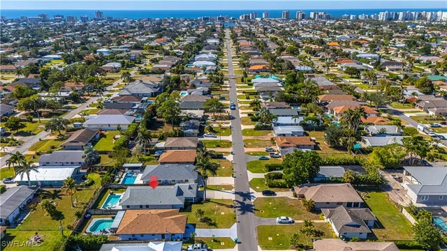 a kitchen with stainless steel appliances a table chairs and a refrigerator