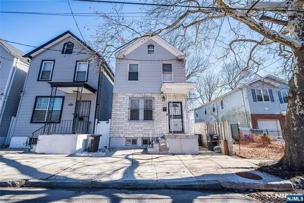 a view of a building with a yard