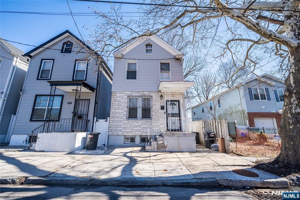 289 Rose Street Newark, NJ 07108 - Photo 1 of 29 a view of a building with a yard