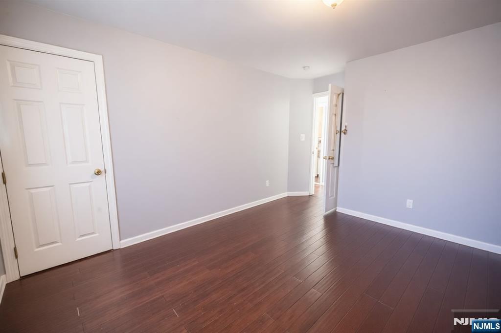 289 Rose Street Newark, NJ 07108 - Photo 16 of 29 a view of an empty room with wooden floor