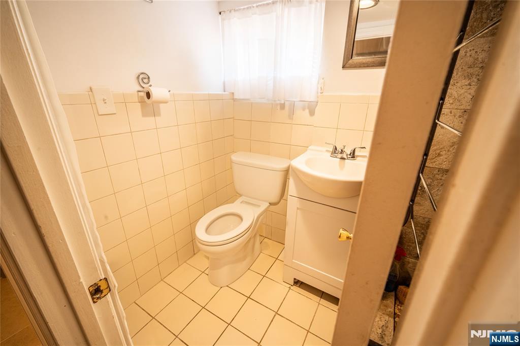 289 Rose Street Newark, NJ 07108 - Photo 21 of 29 a bathroom with a sink and a toilet