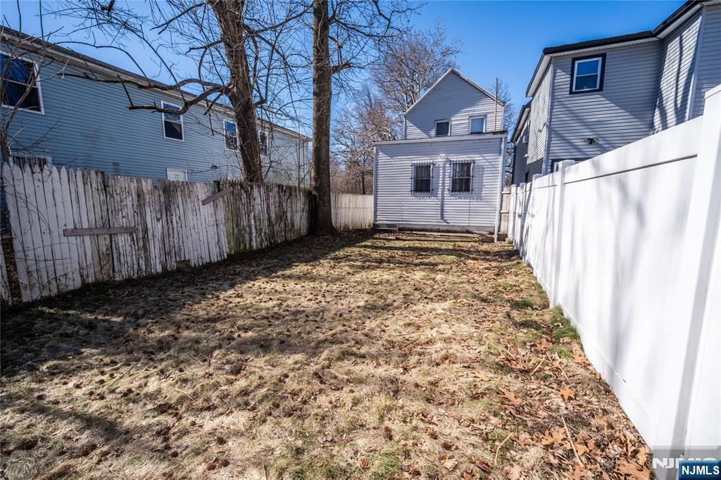 289 Rose Street Newark, NJ 07108 - Photo 29 of 29 a front view of a house with a yard