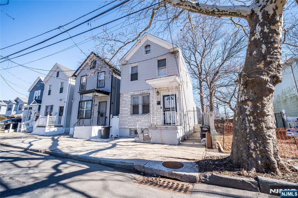 289 Rose Street Newark, NJ 07108 - Photo 3 of 29 a front view of a house with a yard