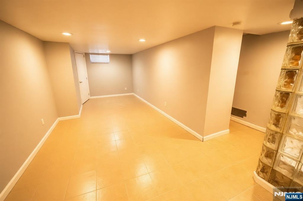 289 Rose Street Newark, NJ 07108 - Photo 7 of 29 a view of a big room with wooden floor