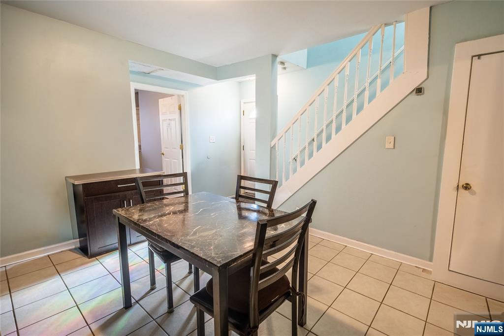 289 Rose Street Newark, NJ 07108 - Photo 9 of 29 a view of a livingroom with furniture and stairs