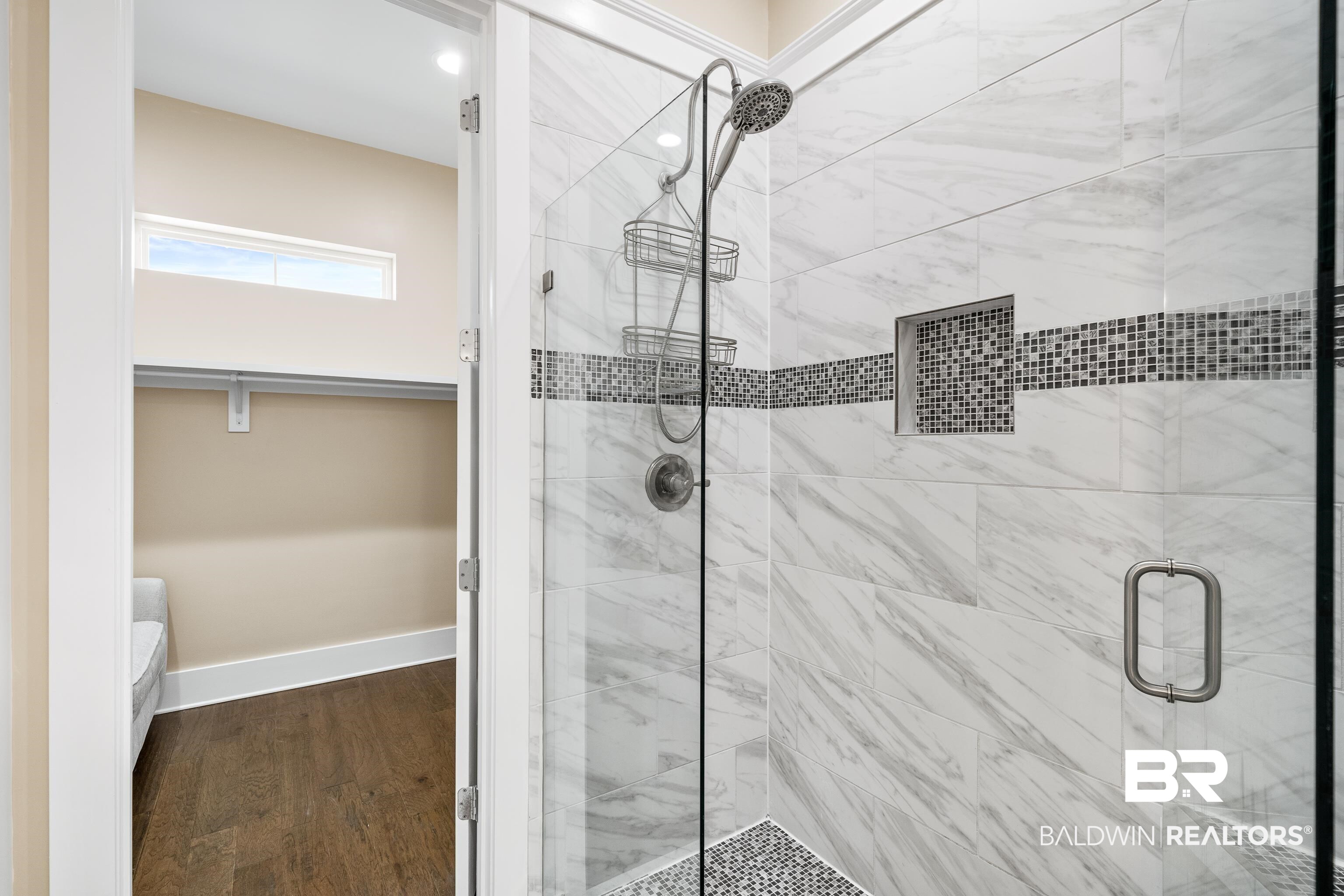 1018 Snapdragon Lane Foley, AL 36535 - Photo 25 of 37 Bathroom featuring a shower with shower door and wood-type flooring