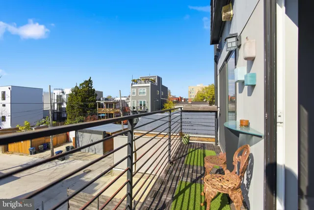 a view of balcony with furniture