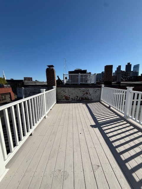 164 Prince Street, Unit 4 Boston, MA 02113 - Photo 14 of 16 a view of balcony with wooden floor