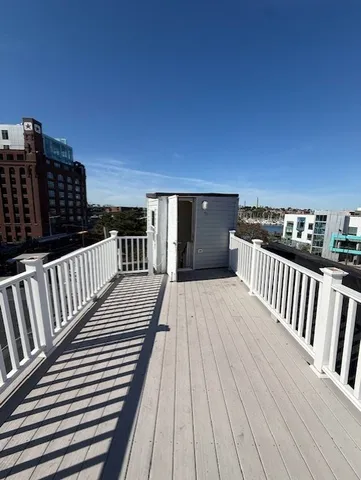 a view of balcony with wooden floor