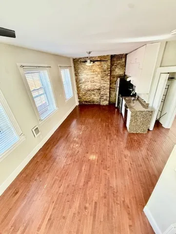 a view of living room with furniture and floor to ceiling window