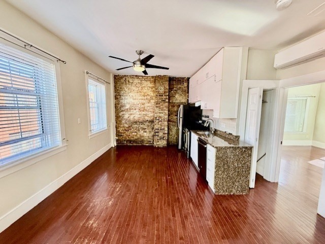 164 Prince Street, Unit 4 Boston, MA 02113 - Photo 2 of 16 a view of a living room with hardwood floor and a ceiling fan