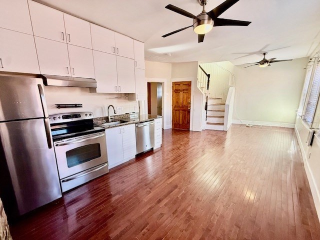 164 Prince Street, Unit 4 Boston, MA 02113 - Photo 5 of 16 a kitchen with granite countertop a refrigerator and a stove top oven