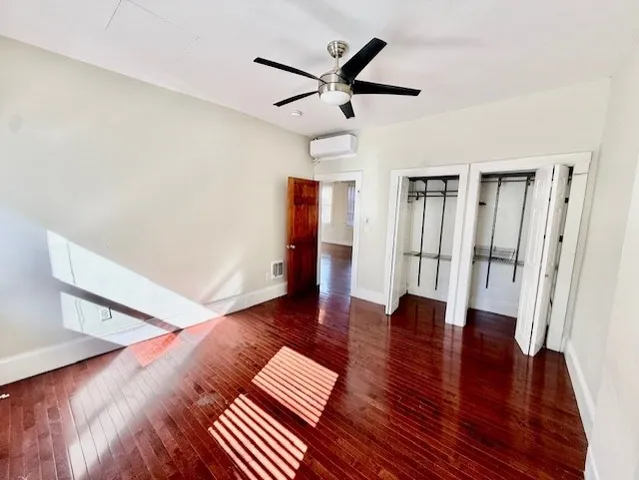 a view of livingroom with hardwood floor and ceiling fan