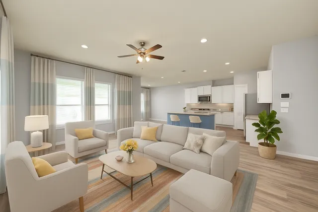 a kitchen with stainless steel appliances granite countertop a dining table chairs refrigerator and sink