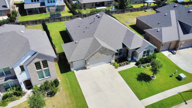 an aerial view of a house with a garden