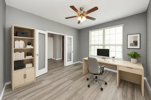 a view of hallway with livingroom and wooden floor