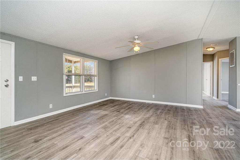 4289 Henry Dellinger Road Maiden, NC 28650 - Photo 11 of 42 wooden floor in an empty room with a window