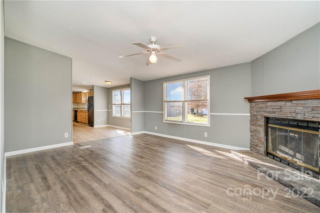 4289 Henry Dellinger Road Maiden, NC 28650 - Photo 13 of 42 a view of an empty room with window and fire place